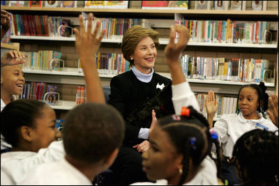 Laura Bush introduces her Scottish Terrier puppy Miss Beazley to fourth-grade students from Maury Elementary School during a visit to the Martin Luther King Jr. Memorial Library in Washington, D.C., Tuesday, April 12, 2005.