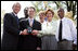 President and Mrs. Bush stand with Jason Kamras, the 2005 National Teacher of the Year, after he was honored during ceremonies in the Rose Garden Wednesday, April 20, 2005. Joining them are Secretary of Education Margaret Spellings and former students Wendall Jefferson, left, and Marco Jeter.