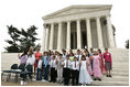 Laura Bush and Secretary of Interior Gale Norton joins Guilford Elementary School students in taking the Junior Ranger pledge from National Park Service Director Fran Mainella during an event at the Thomas Jefferson Memorial in Washington, D.C., April 21, 2005.