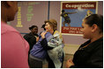 Laura Bush greets students at a reading class while visiting Chipman Middle School in Alameda, Calif., April 28, 2005.