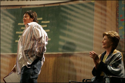 Laura Bush listens as students read aloud in class during a Helping America's Youth event at Chipman Middle School in Alameda, Calif., April 28, 2005.