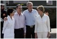 President George W. Bush and Colombian President Alvaro Uribe pose with their wives, U.S. first lady Laura Bush (R) and Colombia first lady Lina Moreno at the President's Central Texas ranch in Crawford, Texas, on August 4, 2005.