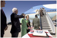 President George W. Bush and Laura Bush are greeted by Arizona Senator John McCain after arriving Monday, Aug. 29, 2005, at Luke Air Force Base near Phoenix. The President later addressed 400 guests at the Pueblo El Mirage RV Resort and Country Club, highlighting benefits of the new Medicare Prescription Drug coverage.