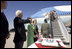 President George W. Bush and Laura Bush are greeted by Arizona Senator John McCain after arriving Monday, Aug. 29, 2005, at Luke Air Force Base near Phoenix. The President later addressed 400 guests at the Pueblo El Mirage RV Resort and Country Club, highlighting benefits of the new Medicare Prescription Drug coverage.