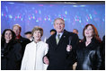 President George W. Bush and Laura Bush join holiday entertainers Thursday evening, Dec. 1, 2005, on stage during the Pageant of Peace and lighting of the National Christmas Tree festivities on the Ellipse in Washington.