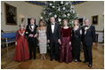 President George W. Bush and Laura Bush pose with the Kennedy Center honorees, from left to right, actress Julie Harris, actor Robert Redford, singer Tina Turner, ballet dancer Suzanne Farrell and singer Tony Bennett, Sunday, Dec. 4, 2005, during the reception in the Blue Room at the White House.