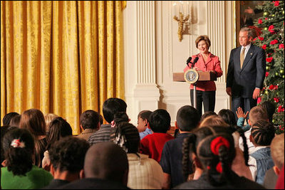 Laura and President Bush welcome children to the White House's Children's Holiday Reception in the East Room Monday, Dec. 5, 2005.