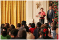 Laura and President Bush welcome children to the White House's Children's Holiday Reception in the East Room Monday, Dec. 5, 2005.