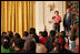 Laura and President Bush welcome children to the White House's Children's Holiday Reception in the East Room Monday, Dec. 5, 2005.