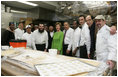 Mrs. Laura Bush is joined by Rabbi Binyomin Taub, Rabbi Hillel Baron and Rabbi Mendy Minkowitz as they stand with staff Tuesday, Dec. 6, 2005, during the kosherizing of the White House kitchen.