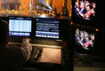 The President and Mrs. Bush are seen on a television monitor Sunday, Dec. 11, 2005, as they enjoyed the festivities during the 24th Annual Christmas in Washington as it was videotaped at the National Building Museum.