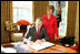 With Laura Bush looking on, President George W. Bush signs a proclamation designating February as American Heart Month in the Oval Office, Feb. 1, 2005. The proclamation encourages awareness of factors leading to heart disease such as smoking, high cholesterol, lack of exercise, obesity and diabetes.