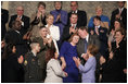 During the State of the Union Address Wednesday, Feb. 2, 2005, Janet and William Norwood, center, comfort each other as President Bush talks about their son, Marine Corps Sergeant Byron Norwood of Pflugerville, Texas, who died during the assault on Fallujah. "Ladies and gentlemen, with grateful hearts, we honor freedom's defenders, and our military families, represented here this evening by Sergeant Norwood's mom and dad, Janet and Bill Norwood," President Bush said during his speech at the U.S. Capitol.