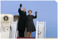 President George W. Bush and Laura Bush wave from the Air Force One stairs en route Brussels, Belgium, Sunday, Feb. 20, 2005. President Bush and Laura Bush flew from Andrews Air Force Base in Maryland to Belgium, beginning a five-day trip to Belgium, Germany and Slovakia.