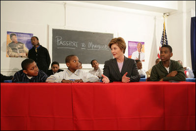 Laura Bush addresses young boys participating in the Passport to Manhood program taught by male staff members at the Germantown Boys and Girls Club Tuesday, Feb. 3, 2005 in Philadelphia. Passport to Manhood promotes and teaches responsibility through a series of classes for male club members ages 11-14.