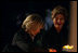 Laura Bush and Mrs. Schroeder-Koepf light candles during a tour of Saint Martin's Cathedral in Mainz, Germany, Feb. 23, 2005.