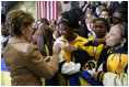 Laura Bush signs autographs for students of General H. H. Arnold High School following her remarks there to students, faculty and parents of the military in Wiesbaden, Germany, Tuesday, Feb. 22, 2005.