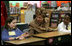 Mrs. Bush greets Hainerberg Elementary School student Hailey Cook during her visit with fourth and fifth graders Tuesday, Feb. 22, 2005 in Wiesbaden, Germany.