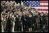 During a Feb. 23, 2005, visit to Wiesbaden Army Air Field in Wiesbaden, Germany, President George W. Bush and Laura Bush are welcomed by applause from U.S. troops.