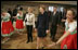 Laura Bush watches dancers during a Wednesday, Feb. 23, 2005, lunch hosted by Chancellor Gerhard Schroeder, behind, and Mrs. Schroeder-Koepf, left, at the Electoral Palace in Mainz, Germany.