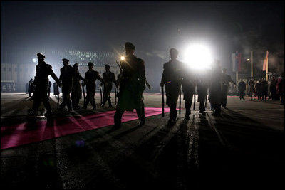 The red carpet is rolled out during the President and Mrs. Bush's night arrival to Bratislava, Slovakia, Wednesday, Feb. 23, 2005.