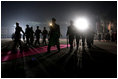 The red carpet is rolled out during the President and Mrs. Bush's night arrival to Bratislava, Slovakia, Wednesday, Feb. 23, 2005.