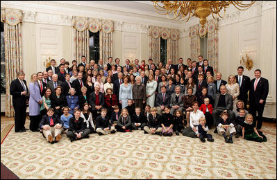 President George W. Bush, Laura Bush, former President George H. W. Bush, and former First Lady Barbara Bush pose for a portrait with members of their extended family in the East Room of the White House, Wednesday, Jan. 19, 2005.