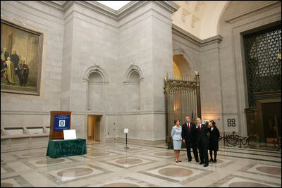 President George W. Bush and Laura Bush tour of the National Archives in Washington, D.C., with National Archivist John Carlin, second on right, and Senior Curator Stacy Bredhoff, right, Wednesday, Jan. 19, 2005. During their tour, President Bush and Mrs. Bush viewed the U.S. Constitution, the Bill of Rights, George Washington's first inaugural address, and the Declaration of Independence.