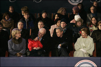 President George W. Bush and Laura Bush sit with Vice President Dick Cheney, Lynne Cheney, and their granddaughter, Grace Perry, during a concert commemorating the 55th Presidential Inauguration on the Ellipse in Washington, D.C., Wednesday, Jan. 19, 2005.