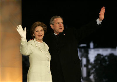 President George W. Bush and Laura Bush arrive on stage for a fireworks display during the inaugural concert 'A Celebration of Freedom' on the Ellipse south of the White House, Wednesday, Jan. 19, 2005.