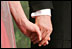 George W. Bush and Laura Bush hold hands during a Black Tie and Boots Ball in Washington, D.C., Jan. 19, 2005.