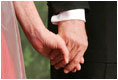 George W. Bush and Laura Bush hold hands during a Black Tie and Boots Ball in Washington, D.C., Jan. 19, 2005.