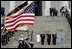 Escorted by Army Major General Galen Jackman, center, President George W. Bush, Laura Bush, Vice President Dick Cheney and Lynne Cheney salute the American flag from the U.S. Capitol steps before President Bush takes the oath of office for a second term as the 43rd President of the United States, Thursday, January 20, 2005.