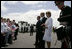 President George W. Bush and Laura Bush are greeted by ceremony and cheers upon their arrival at Glasgow Prestwick International Airport in Scotland July 6, 2005.