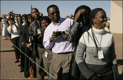 People wait in line to see the departure of Laura Bush Monday, July 11, 2005 at Gaborone International Airport in Gaborone, Botswana.