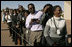 People wait in line to see the departure of Laura Bush Monday, July 11, 2005 at Gaborone International Airport in Gaborone, Botswana.