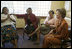 Laura Bush meets with women from Mothers to Mothers-to-Be in Cape Town, South Africa, Tuesday, July 12, 2005. The program provides support to HIV-positive women during their pregnancy.