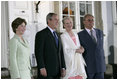 President George W. Bush and Mrs Bush join Her Majesty Queen Margrethe II and His Royal Highness The Prince Henrik of Denmark after arriving at the Fredensborg Palace, Tuesday, July 5, 2005.