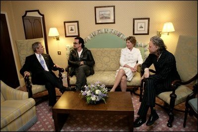 President George W. Bush, Bono, Laura Bush and Bob Geldof, far right, hold a working meeting on Africa at the G8 Summit in Gleneagles, Scotland, Wednesday, July 6, 2005.