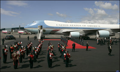 As President George W. Bush and Laura Bush disembarks Air Force One, a band is poised for their arrival at Glasgow's Prestiwick Airport, July 6, 2005.