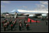 As President George W. Bush and Laura Bush disembarks Air Force One, a band is poised for their arrival at Glasgow's Prestiwick Airport, July 6, 2005.