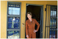 Laura Bush pauses in a doorway during an interview with Ann Curry of The Today Show at Philani, Tuesday July 12, 2005, in Cape Town, South Africa.