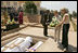 Laura Bush and daughter Jenna lay a wreath Thursday, July 14, 2005 at the Kigali Memorial Center-Gisozi Genocide Memorial in Kigali, Rwanda.