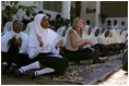 Jenna Bush sits with students at the Kiembesamaki Teacher Training School in Zanzibar, Tanzania, Wednesday, July 14, 2005.