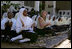 Jenna Bush sits with students at the Kiembesamaki Teacher Training School in Zanzibar, Tanzania, Wednesday, July 14, 2005.