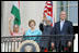 President Bush stands with India's Prime Minister Dr. Manmohan Singh, Laura Bush and Singh's wife, Mrs. Gursharan Kaur, Monday, July 18, 2005 during the Prime Minister's official visit to the White House.