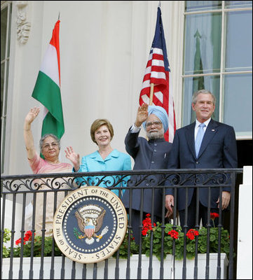 President Bush stands with India's Prime Minister Dr. Manmohan Singh, Laura Bush and Singh's wife, Mrs. Gursharan Kaur, Monday, July 18, 2005 during the Prime Minister's official visit to the White House.