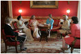 Laura Bush and Mrs. Gursharan Kaur, wife of India's Prime Minister Dr. Manmohan Singh, meet for coffee Monday, July 18, 2005, during an official visit to the White House.