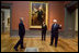 President and Mrs. Bush receive a tour of the Gilbert Stuart Exhibition at the National Gallery of Art from Earl "Rusty" Powell III, gallery director Monday, July 25, 2005, in Washington.