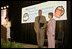 Laura Bush and her brother-in-law Florida Gov. Jeb Bush are applauded upon their arrival at the Teen Trendsetters Reading Mentors 2005 Annual Summit, July 26, 2005 at the Wyndham Orlando Resort in Orlando, Florida.